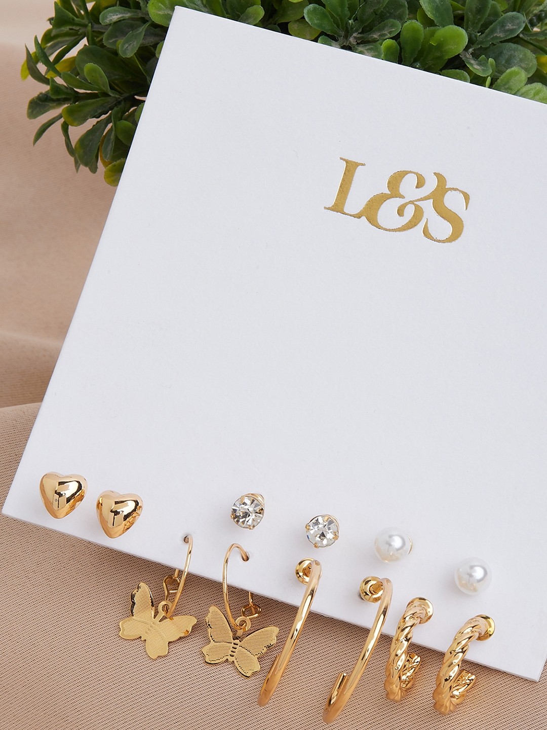 Gold toned set of 3 hoops and 3 studs earrings