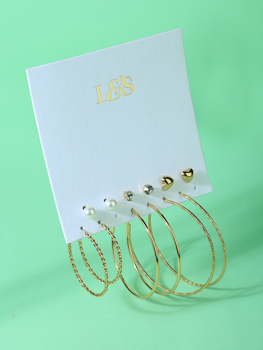 Gold toned set of 3 crystal and heart shaped studs and 3 hoop pack