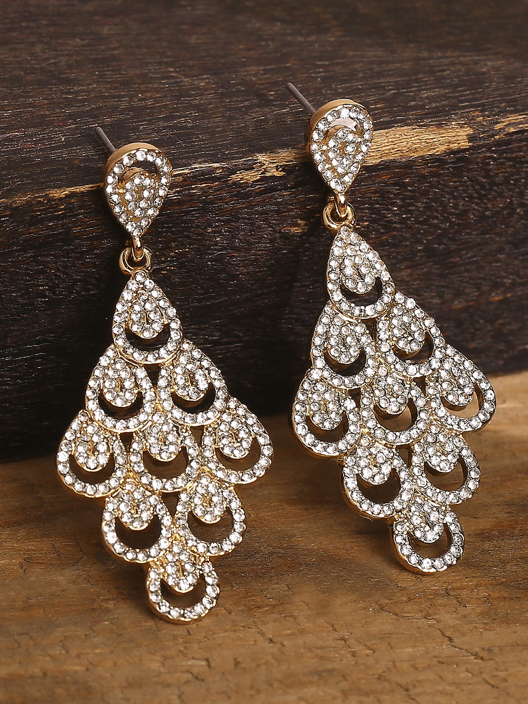 gold toned crystal studded statement dangler earrings