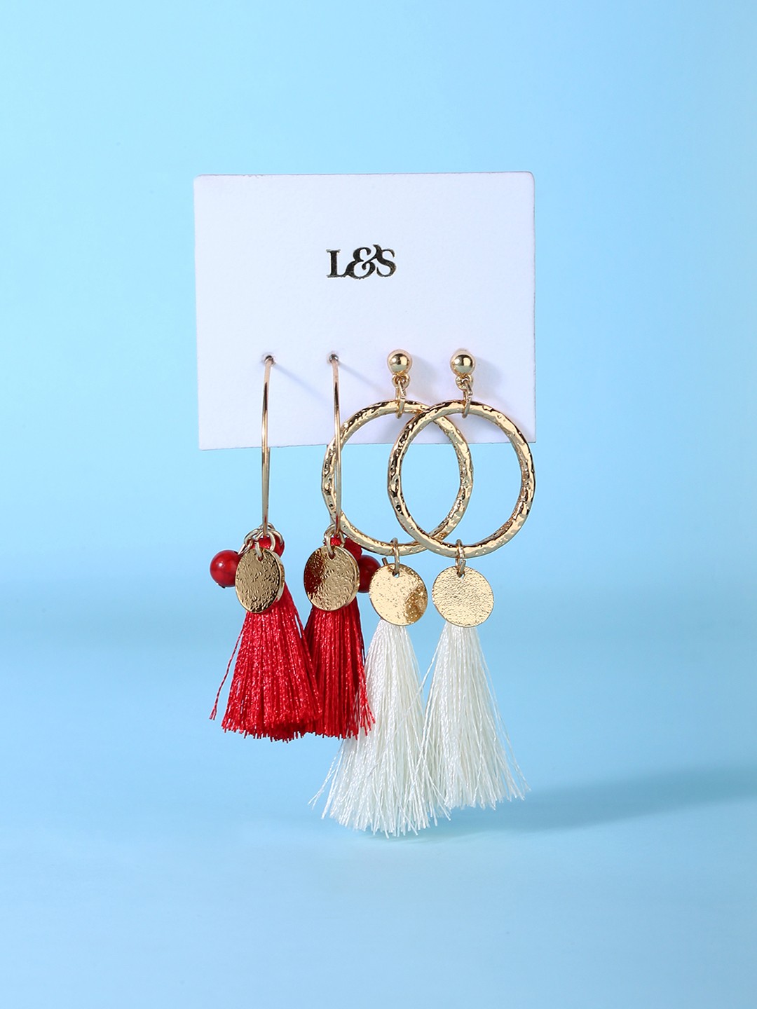 Gold toned red and white tassel dangler earrings