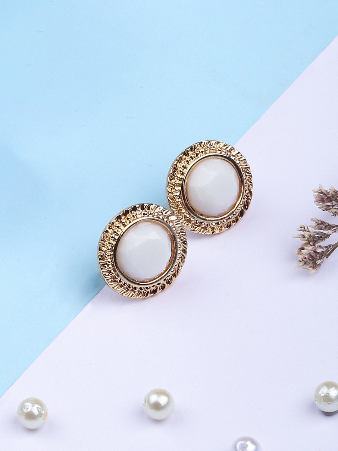 Gold tonned white crystal stud earrings