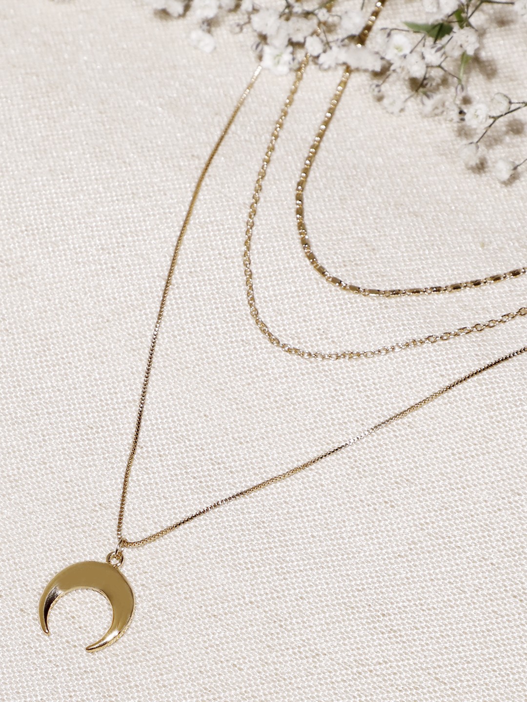 Gold toned 3 layered necklace with moon pendant