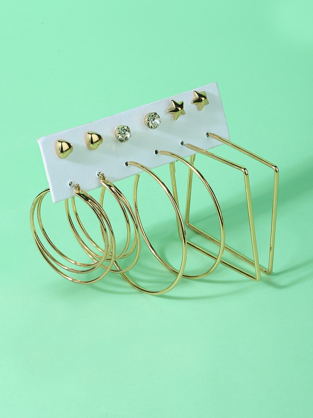Gold toned set of 3 studs and 3 round and square shaped hoop earrings