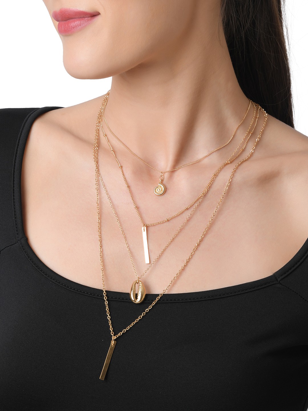 Gold toned four layered necklace with shell and bar pendant