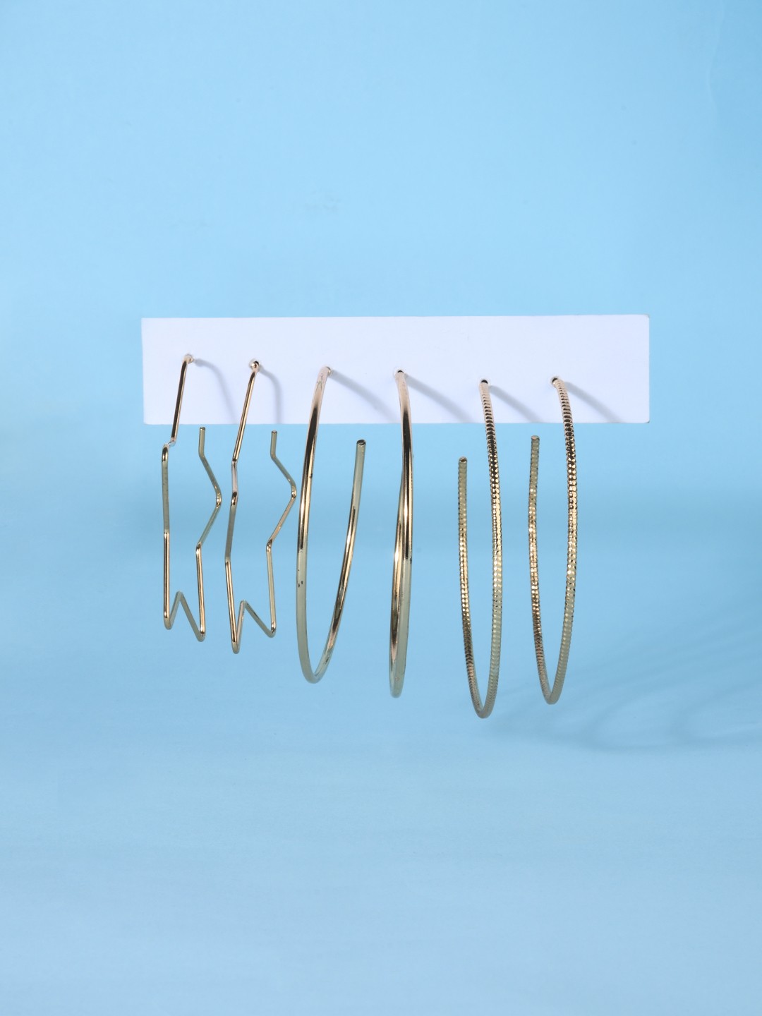 Set of 3 Gold toned star and round hoop earrings