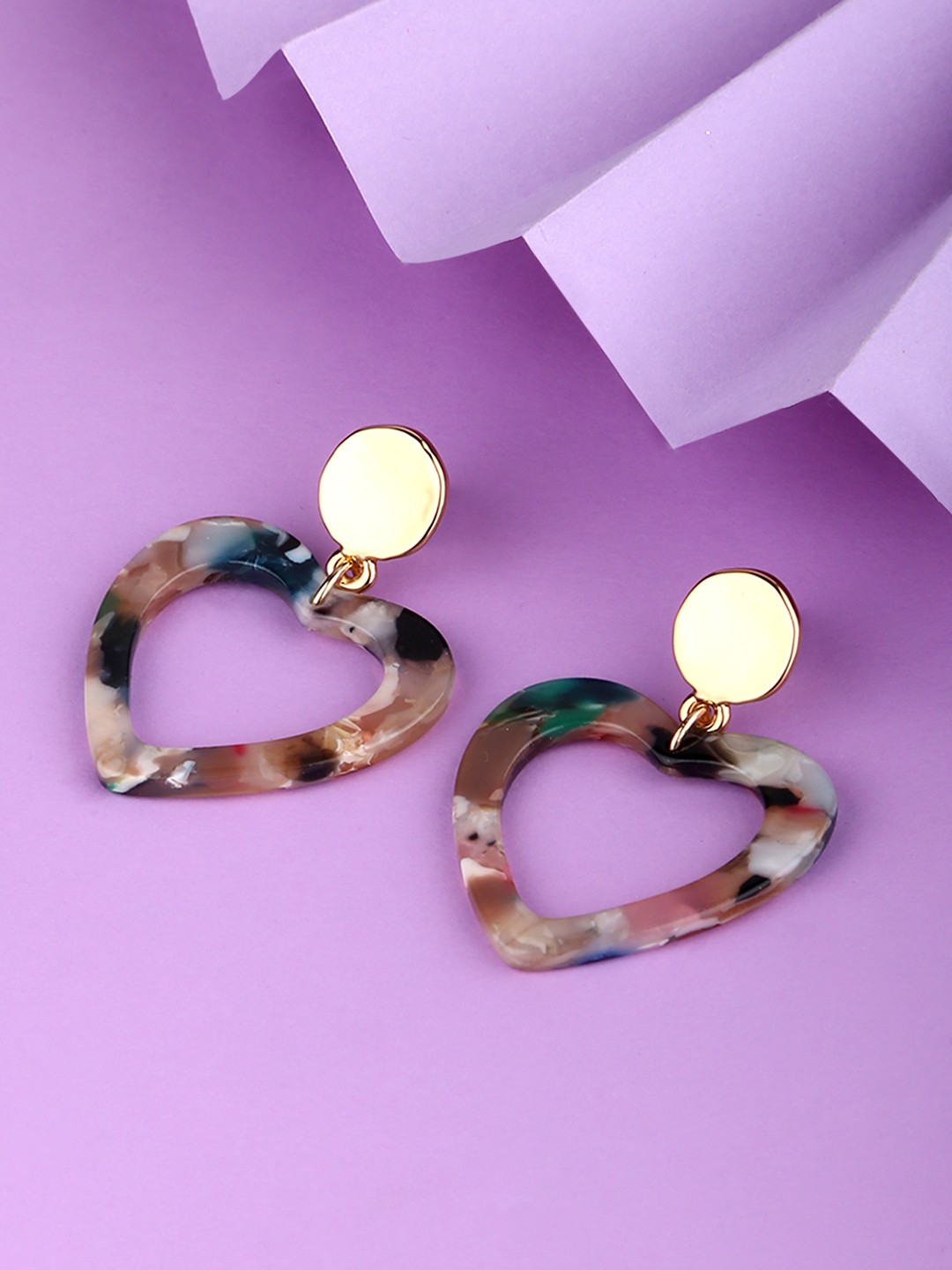 Gold toned heart shaped acetate drop earrings