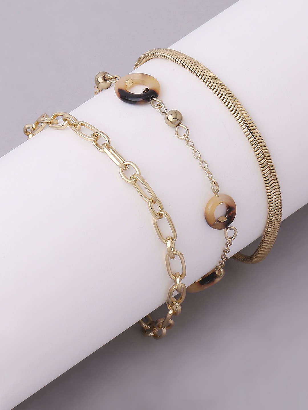 Gold toned set of acetate and link chain bracelet