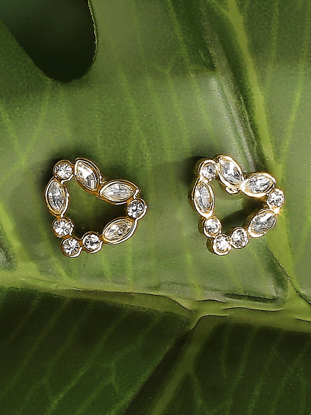 Gold toned crystal studded heart stud earrings