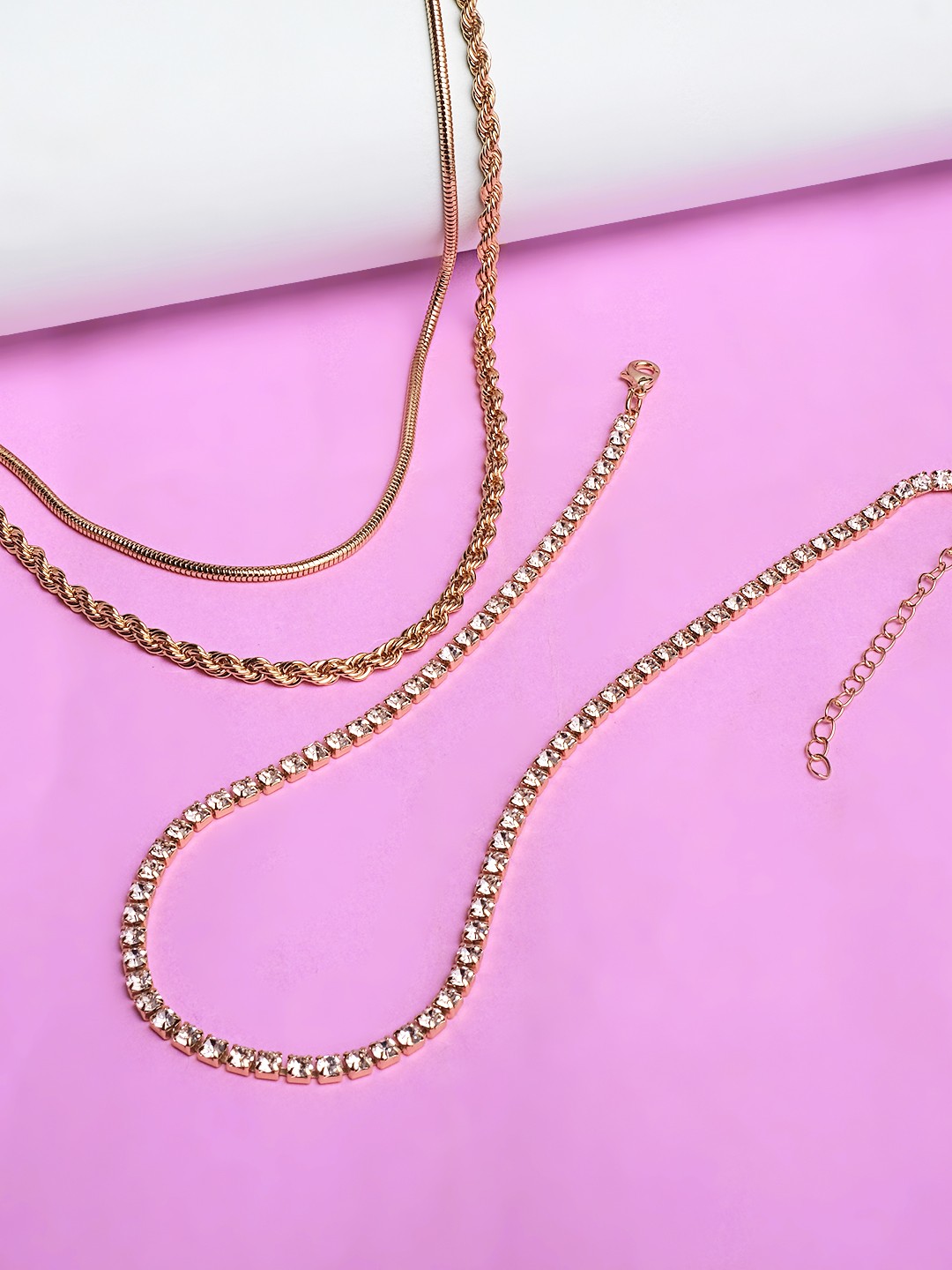 Gold toned 3 layered necklace with crystal chain