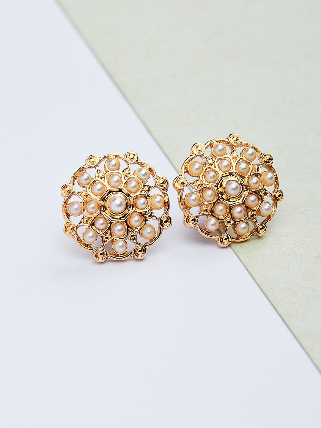 Gold toned pearl embellished stud earrings