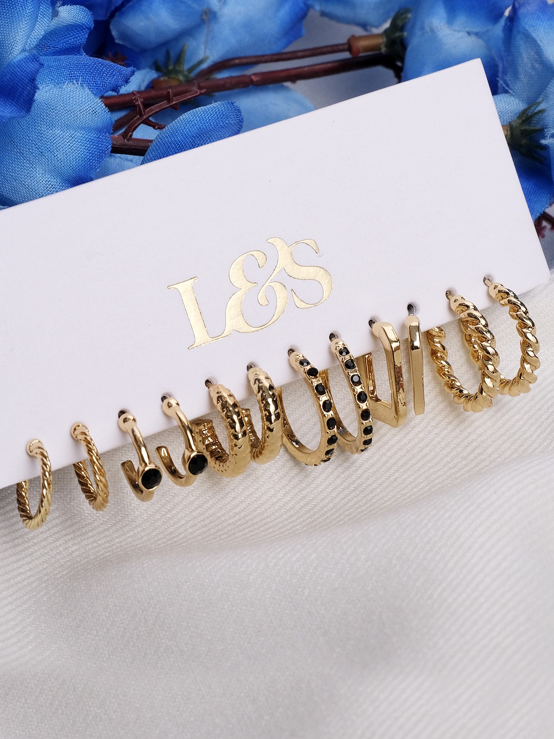 Gold toned set of 6 hoop earrings with black stone