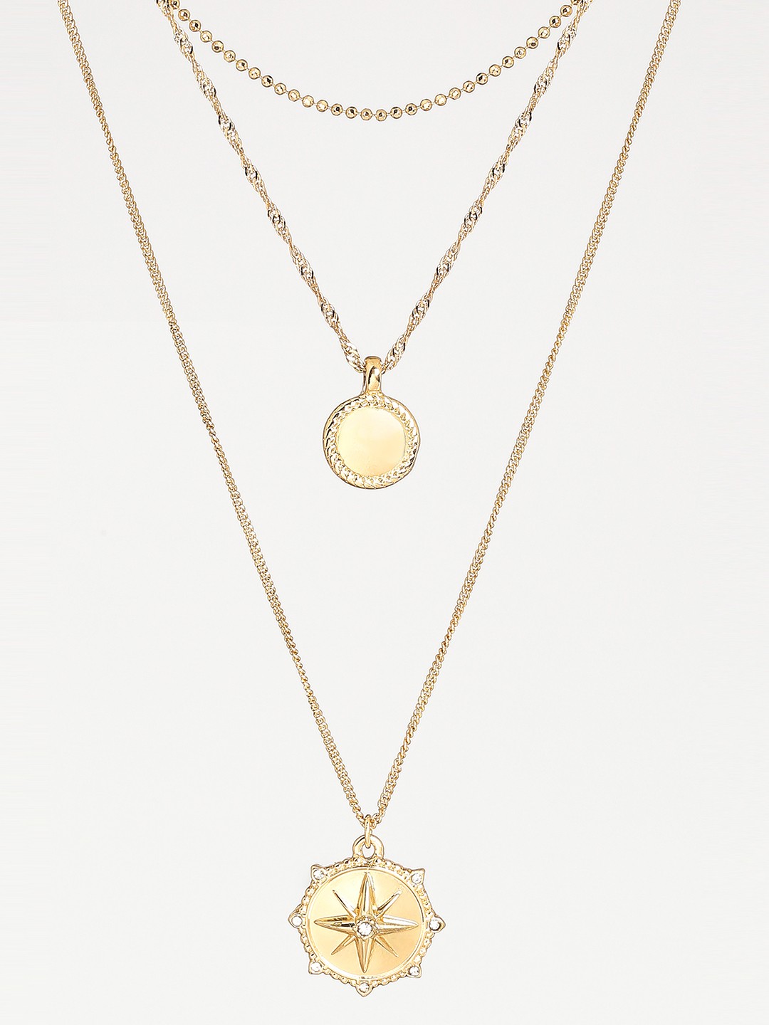 Gold toned three layered necklace with coin and north star pendant