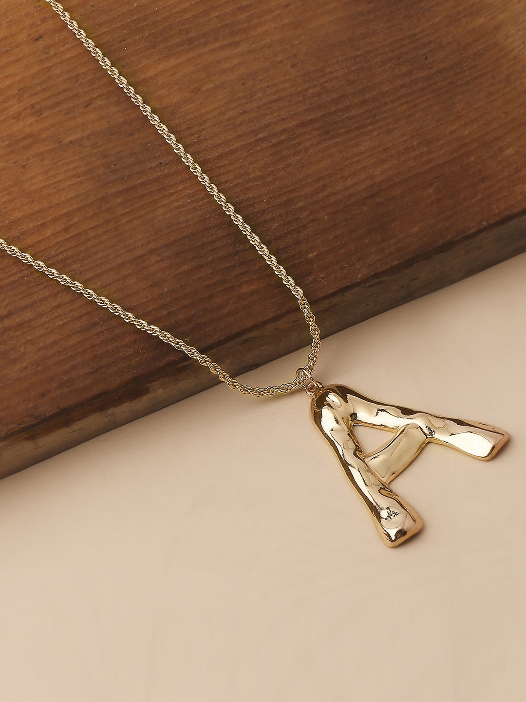 Gold toned chain with initial A pendant