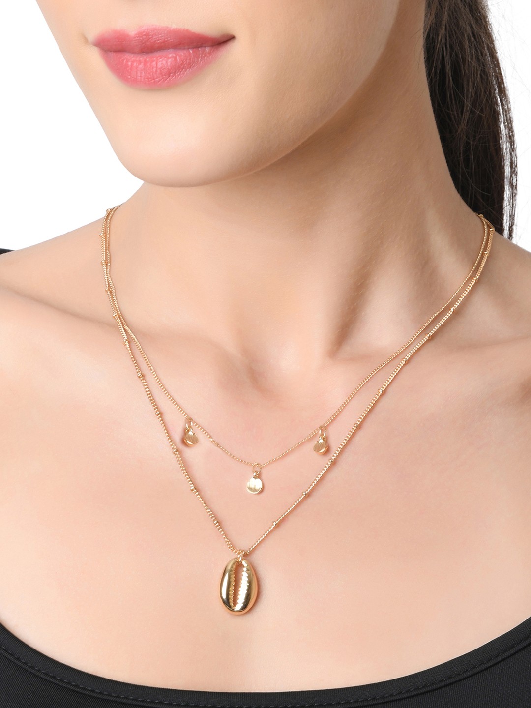 Gold toned two layered necklace with shell pendant