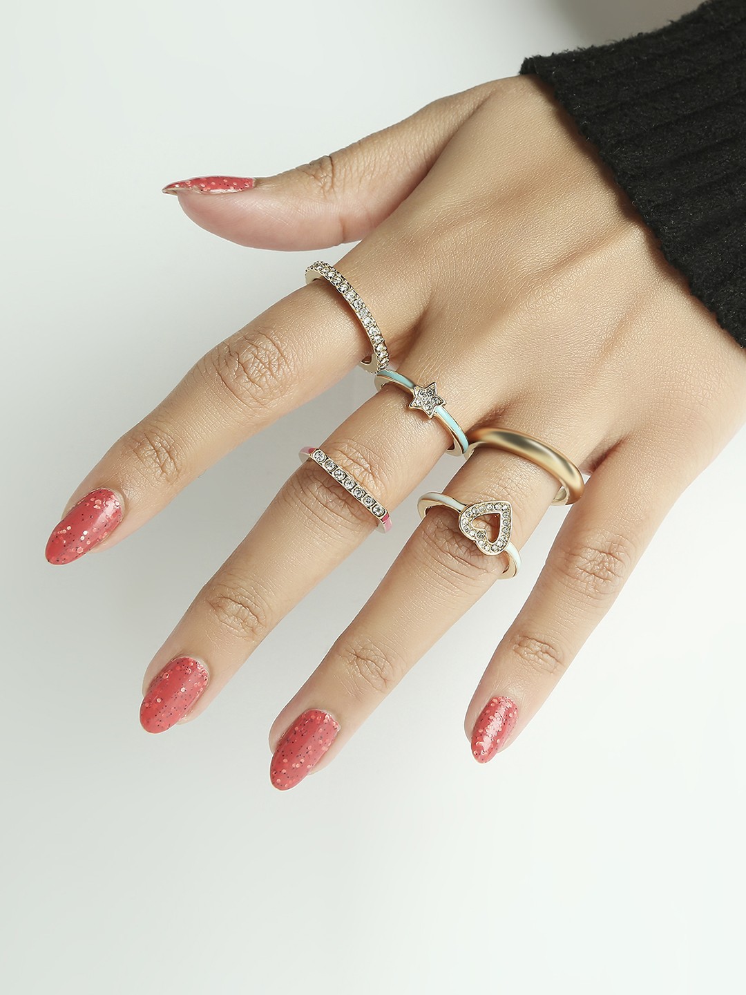 Set of 5 gold toned crystal studded heart and star enameled rings