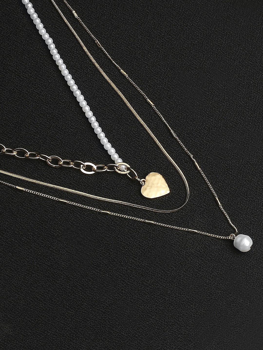 Gold tonned Three layered pearl necklace with heart charm