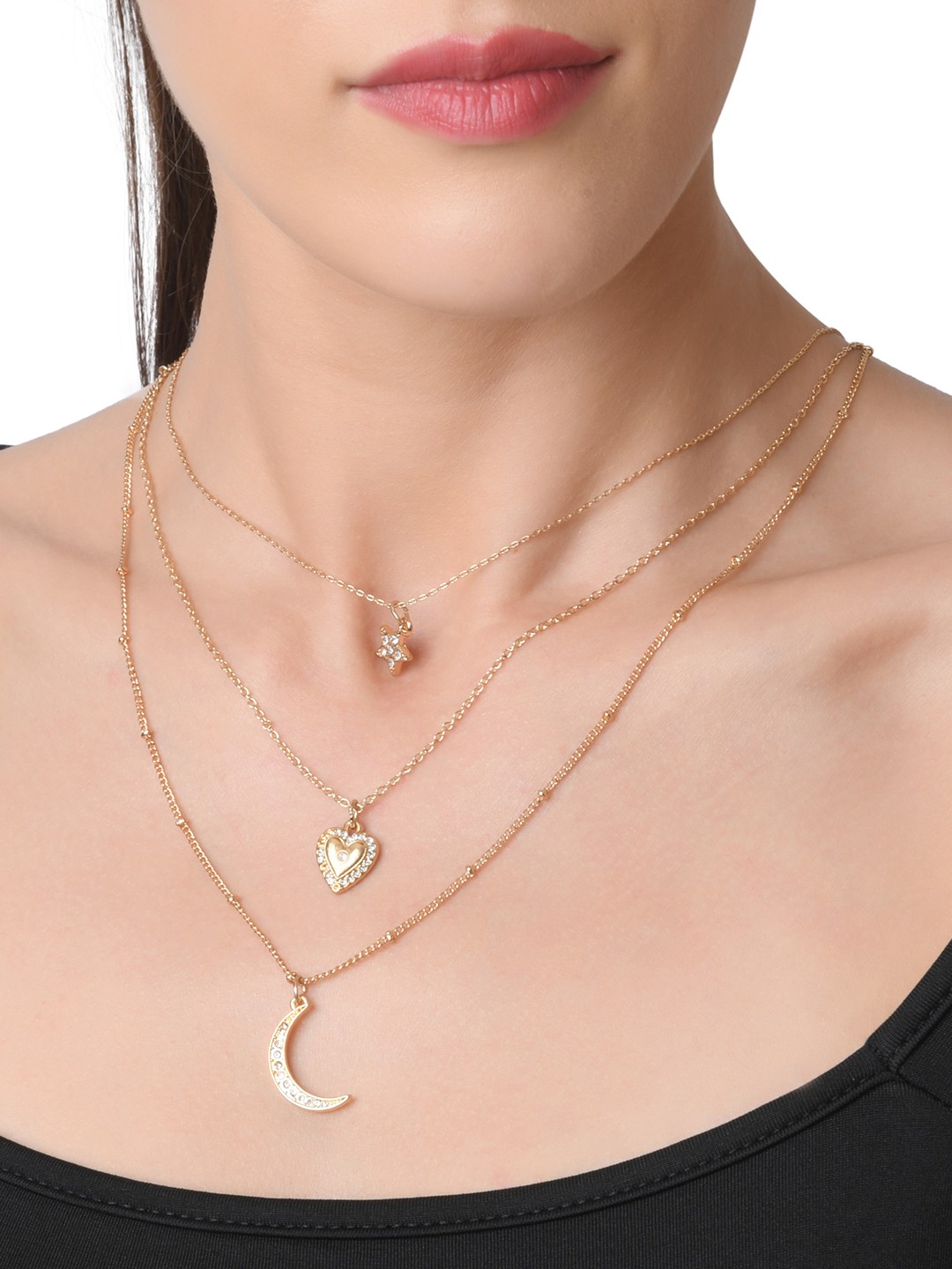Gold toned three layered necklace with crystal studed star, mood and heart charm